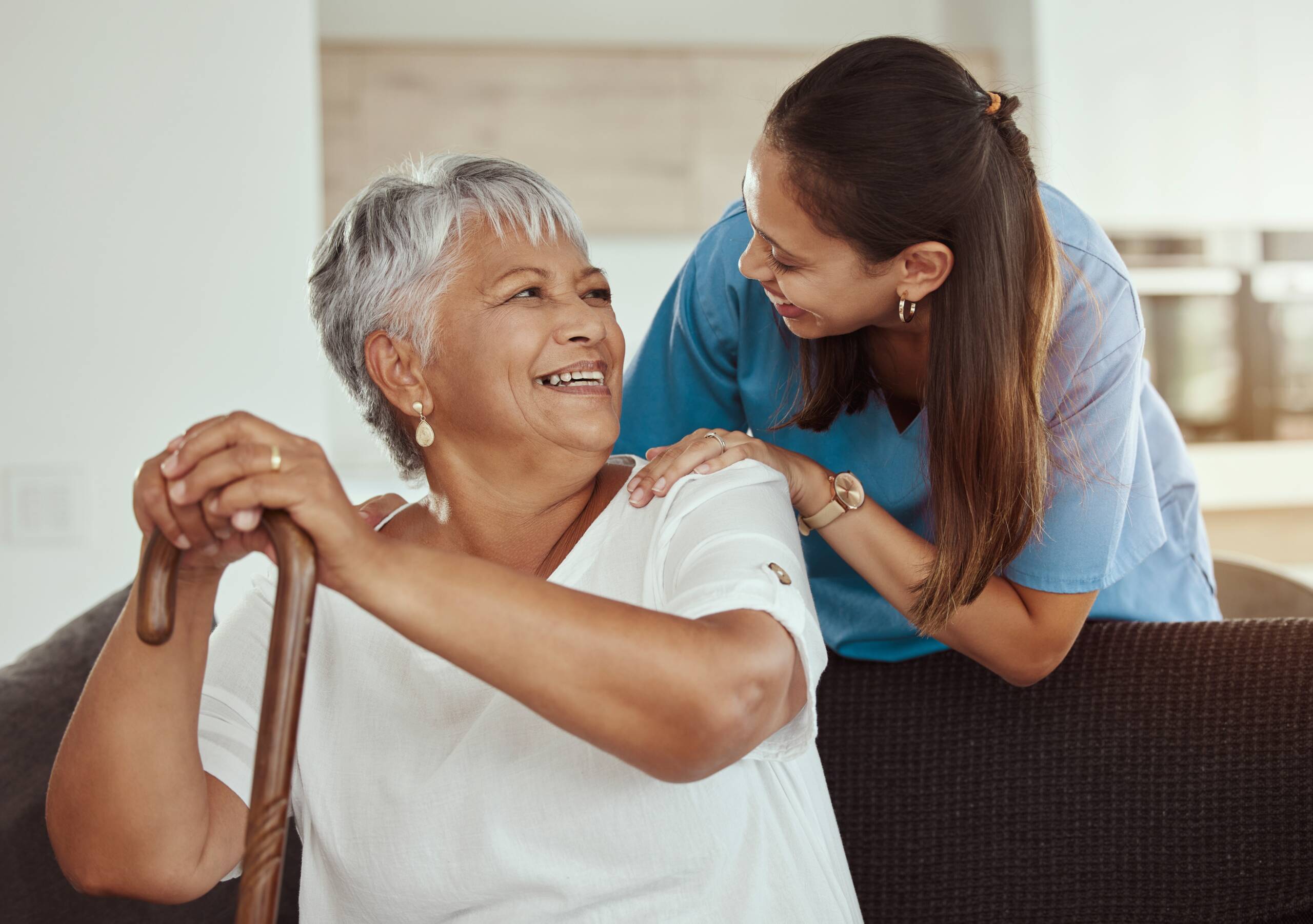 Happy senior at home with technician