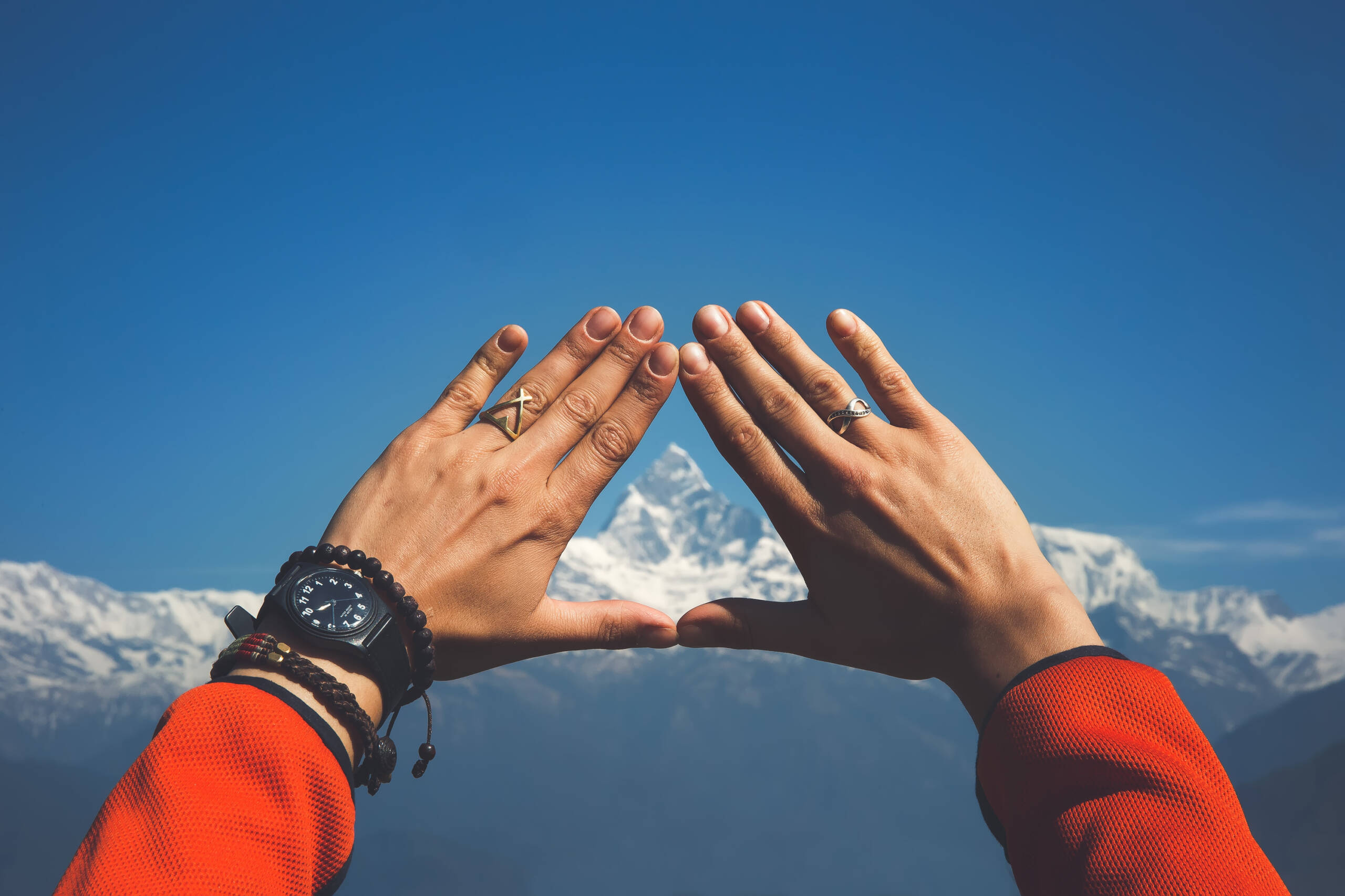 forming a triangle with hands to frame a view